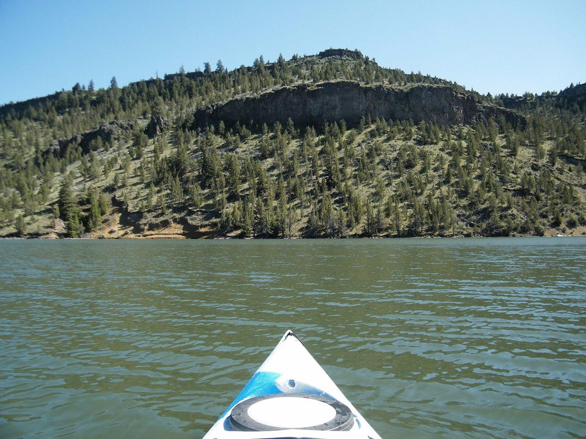 Kayaker's view across Ochoco Reservoir toward a rimrock bluff